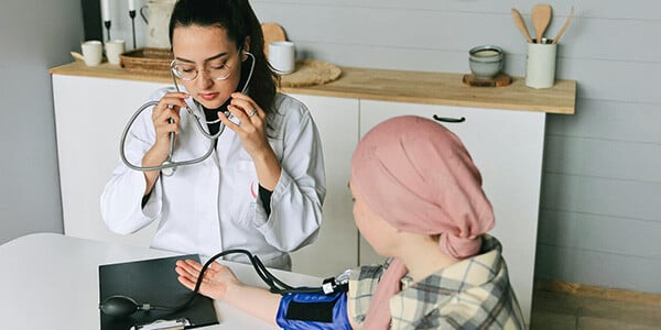 Cancer patient undergoing treatment with doctor